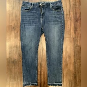 Levi’s Petite high rise skinny dark wash jeans with distressed cuffs